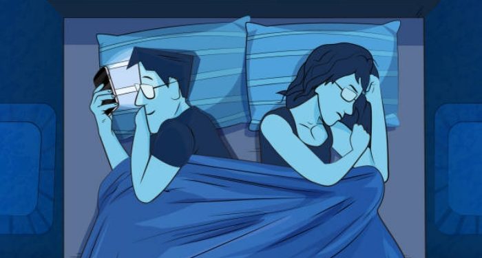 Man with smartphone ignoring his girlfriend in bed. (Used clipping mask)